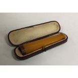 An amber mounted cigarette holder in case. Approx.