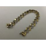 A good diamond curb link gent's bracelet with conc