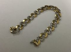 A good diamond curb link gent's bracelet with conc