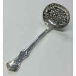 EXETER: A large lily pattern silver sifter spoon.