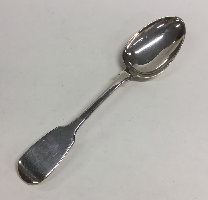 A large fiddle pattern silver tablespoon. London.