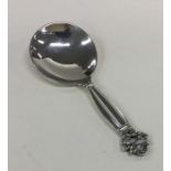 GEORG JENSEN: A stylish silver caddy spoon of text