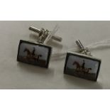 A pair of modern silver and enamelled cufflinks mo