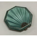 A stylish silver and enamelled compact with marcas