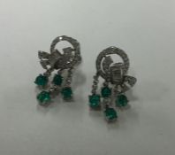 A pair of fine Art Deco cabochon emerald and diamo