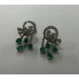 A pair of fine Art Deco cabochon emerald and diamo