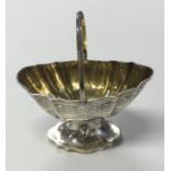 EXETER: A Victorian silver bright cut sugar basket