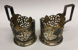 A pair of Russian silver gilt and Niello tea glass