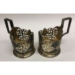 A pair of Russian silver gilt and Niello tea glass