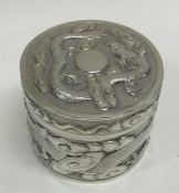 A large Chinese silver box chased with dragons and