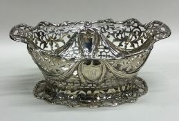 A stylish silver two handled pierced dish on sprea