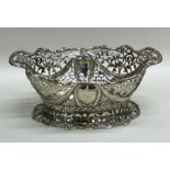 A stylish silver two handled pierced dish on sprea