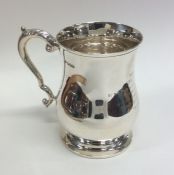 A Georgian style baluster shaped silver pint mug o