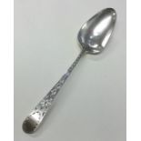 EXETER: A Georgian silver bright cut berry spoon.