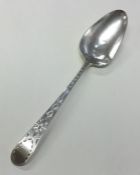 EXETER: A Georgian silver bright cut berry spoon.