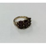 An amethyst three row 9 carat ring. Approx. 4.6 gr