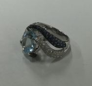 A large aquamarine and diamond dress ring with sap