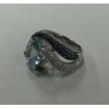 A large aquamarine and diamond dress ring with sap