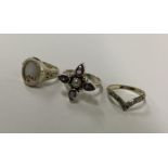 A bag containing silver gem set and other rings. A
