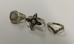 A bag containing silver gem set and other rings. A