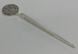 A large silver letter opener depicting The Prince