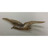 An Antique horn brooch in the form a bird with out