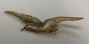 An Antique horn brooch in the form a bird with out