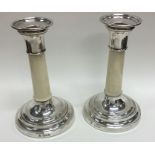 A pair of early Edwardian tapering silver candlest