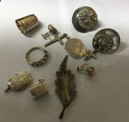 A bag containing a silver thimble, pendants etc. A