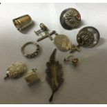 A bag containing a silver thimble, pendants etc. A