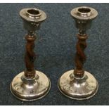 A pair of silver mounted and oak barley twist cand