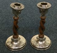 A pair of silver mounted and oak barley twist cand