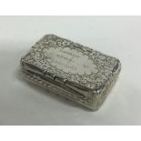 An Edwardian silver snuff box with engraved decora