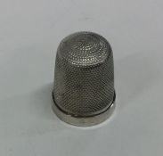 An engine turned Sterling silver thimble. Approx.