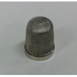 An engine turned Sterling silver thimble. Approx.