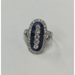 A large platinum sapphire and diamond dress ring w