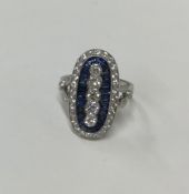 A large platinum sapphire and diamond dress ring w