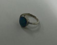 A 9 carat opal single stone ring. Approx. 2.1 gram