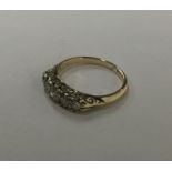A diamond five stone ring in claw mount. Approx. 4