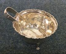 A silver sugar bowl together with a pair of rat ta