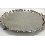 A large Georgian silver pie crust salver on three