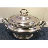 A large silver plated soup tureen. Est. £30 - £50.