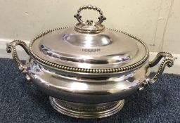 A large silver plated soup tureen. Est. £30 - £50.