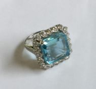 An Art Deco aquamarine and diamond cluster ring in