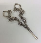 A pair of Continental silver grape scissors emboss