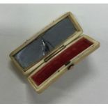 A rectangular ivory and gold inlaid toothpick box