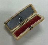 A rectangular ivory and gold inlaid toothpick box