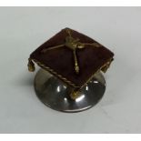 An unusual silver pin cushion mounted with Crown a