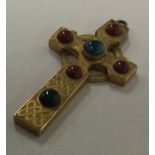 An unusual Celtic cross inset with hard stones. Ap