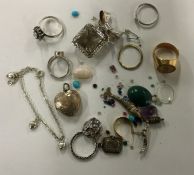 A bag containing silver and other costume jeweller